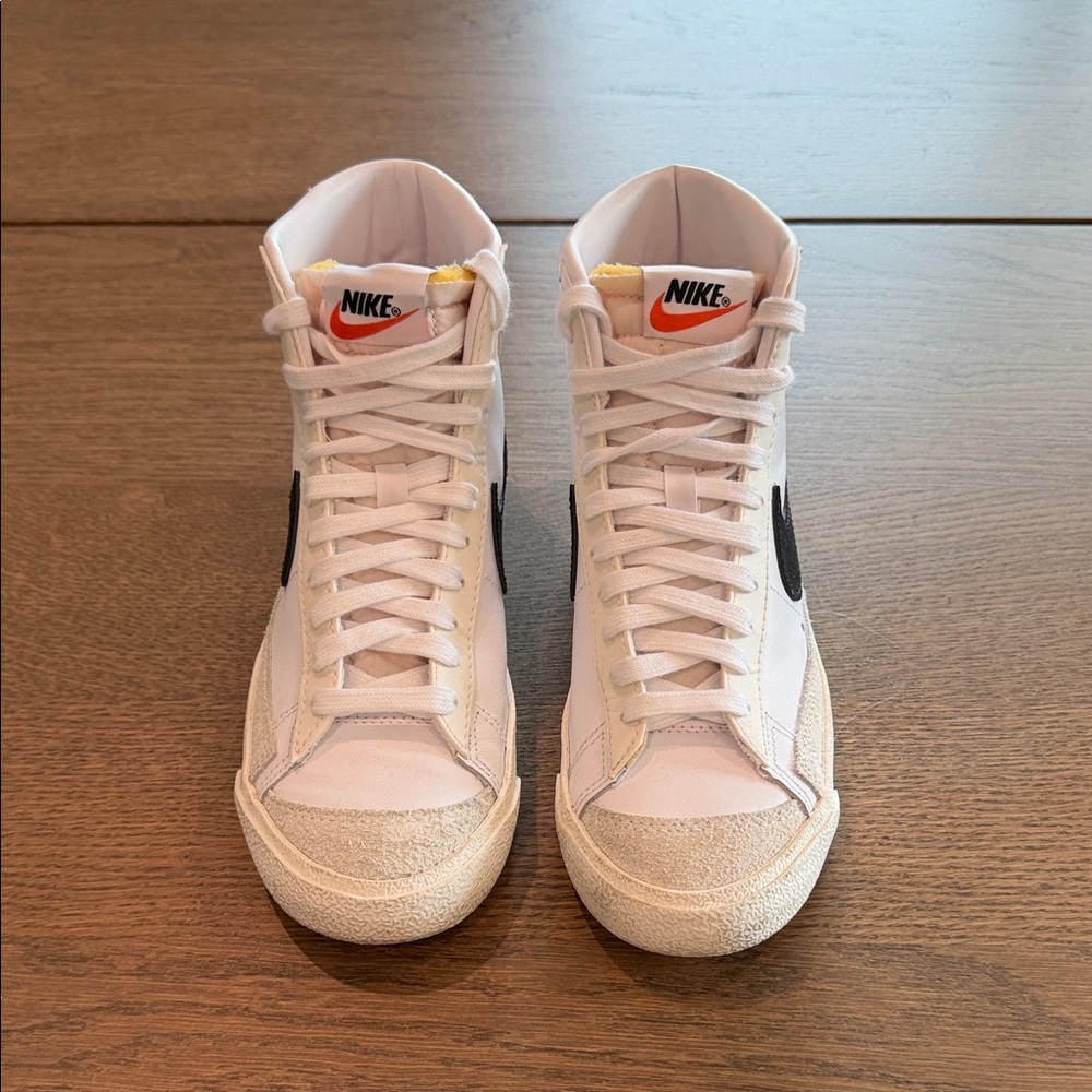Nike White High-Top Sneakers with Black Swoosh